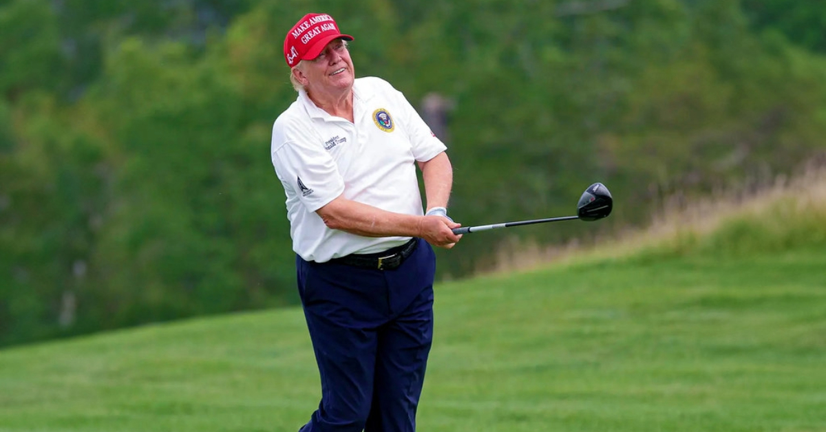 Donald Trump playing golf.