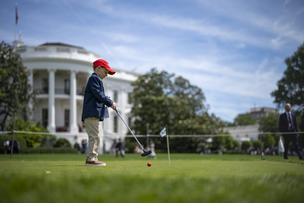 A child playing golf at the White House