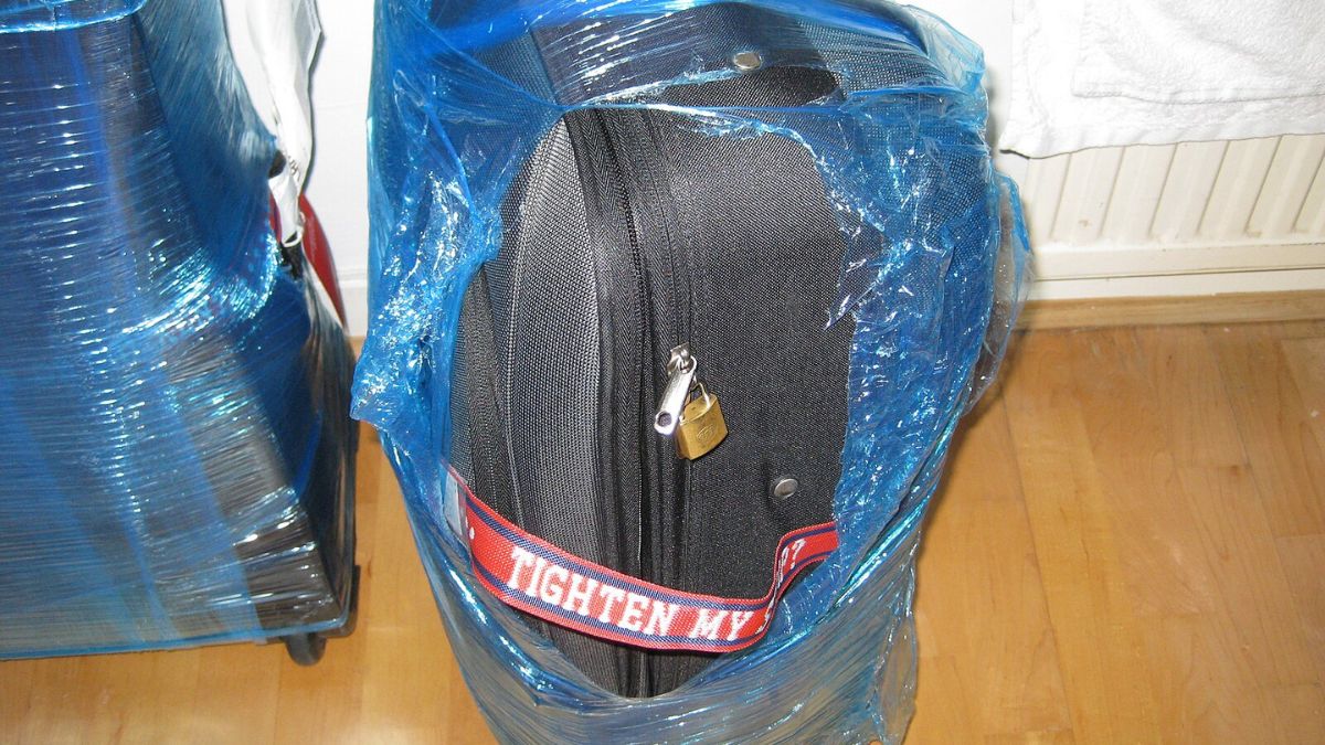 wrapped luggage opened