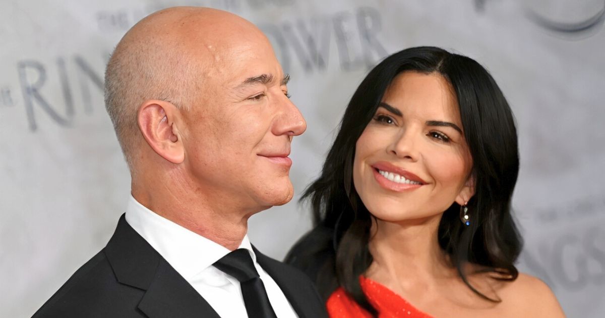 Jeff Bezos and Lauren Sánchez smiling at a formal event, preparing for wedding