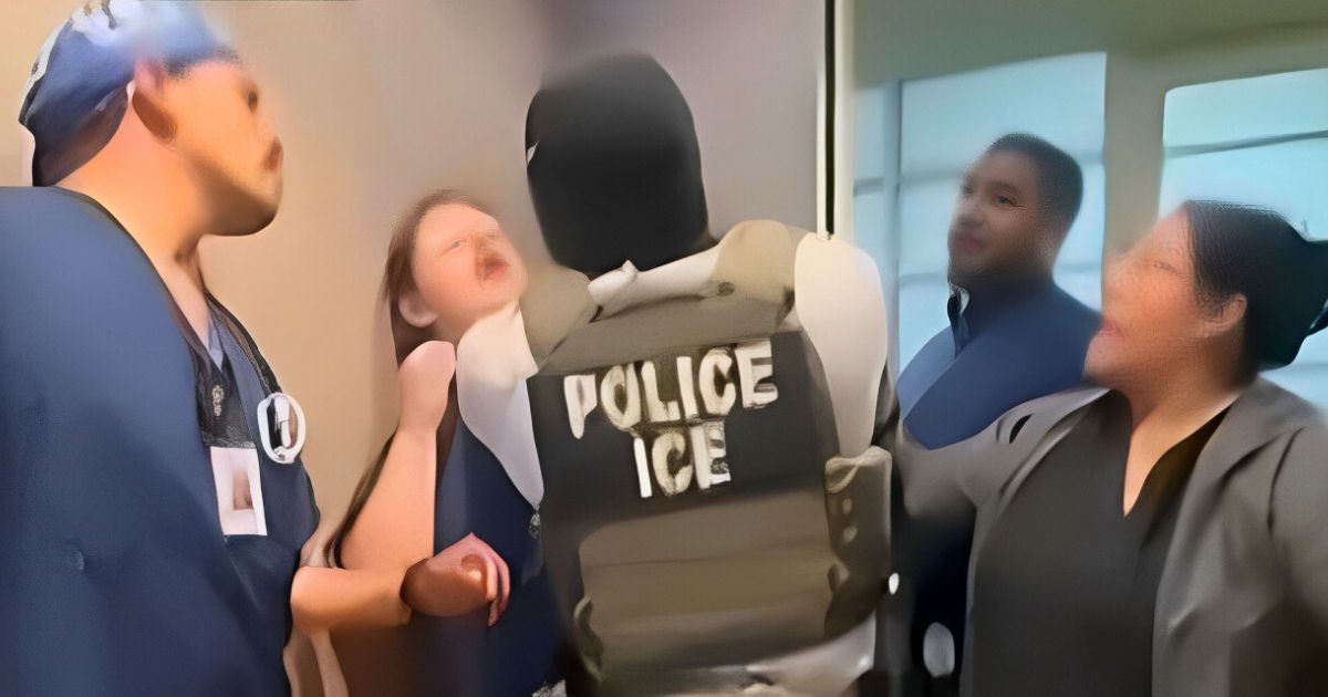 Clinic staff in blue scrubs blocking ICE agents from arresting a Honduran immigrant in California