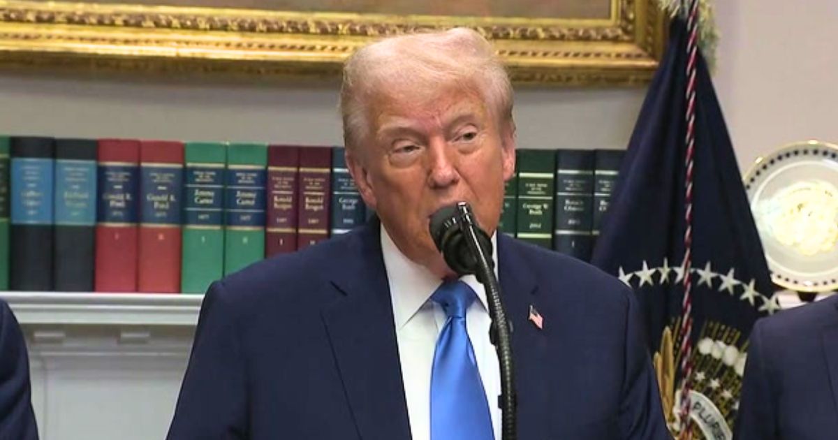 Donald Trump at a press podium making remarks about Democrats and Tylenol.